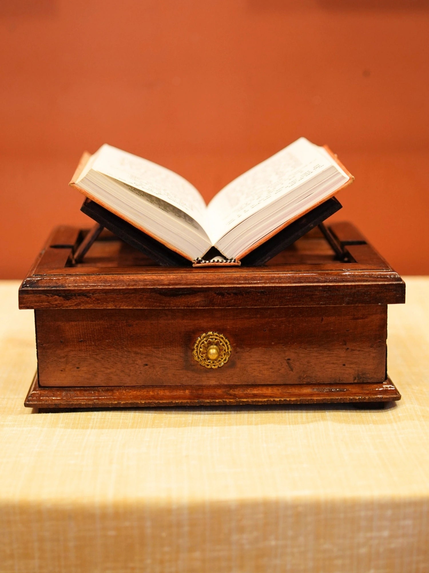 A vintage brown wooden book stand made with wood and brass and a perfect stand to keep a book and keep worship utility