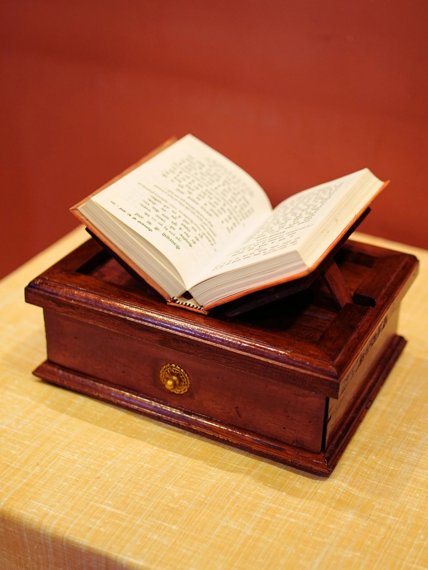 A vintage brown wooden book stand made with wood and brass and a perfect stand to keep a book and keep worship utility