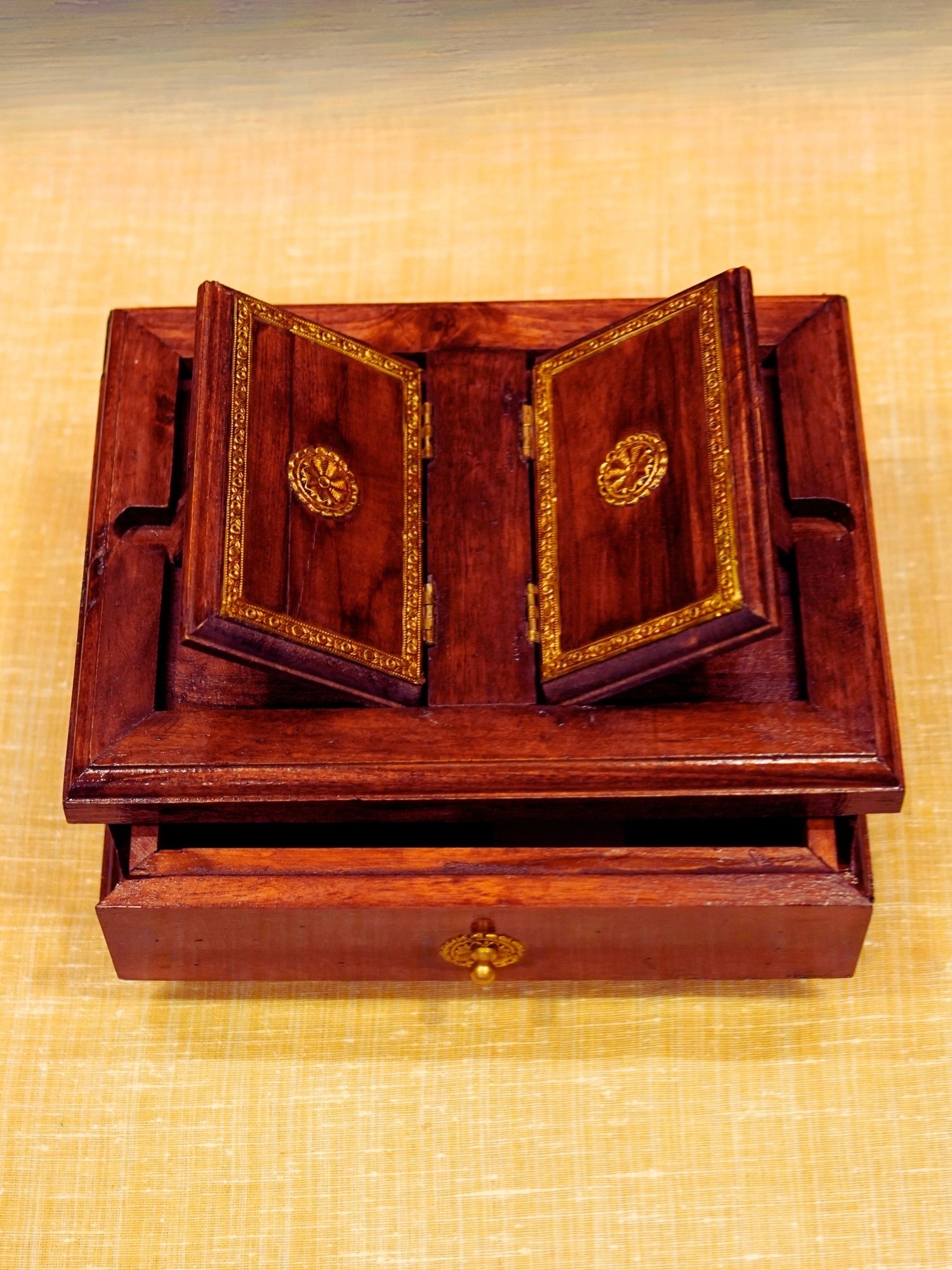 A vintage brown wooden book stand made with wood and brass and a perfect stand to keep a book and keep worship utility