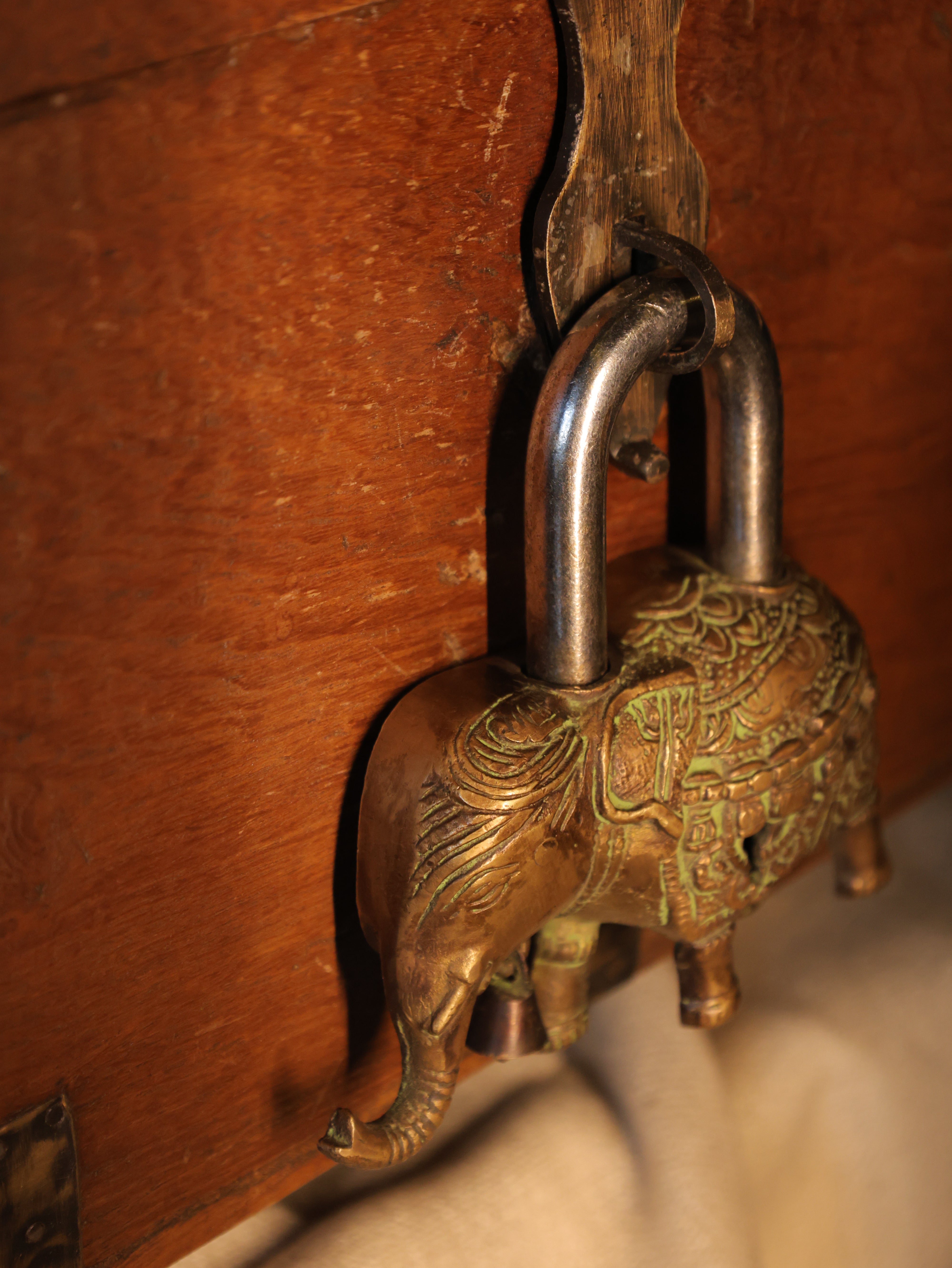 Bronze padlock on a wooden surface