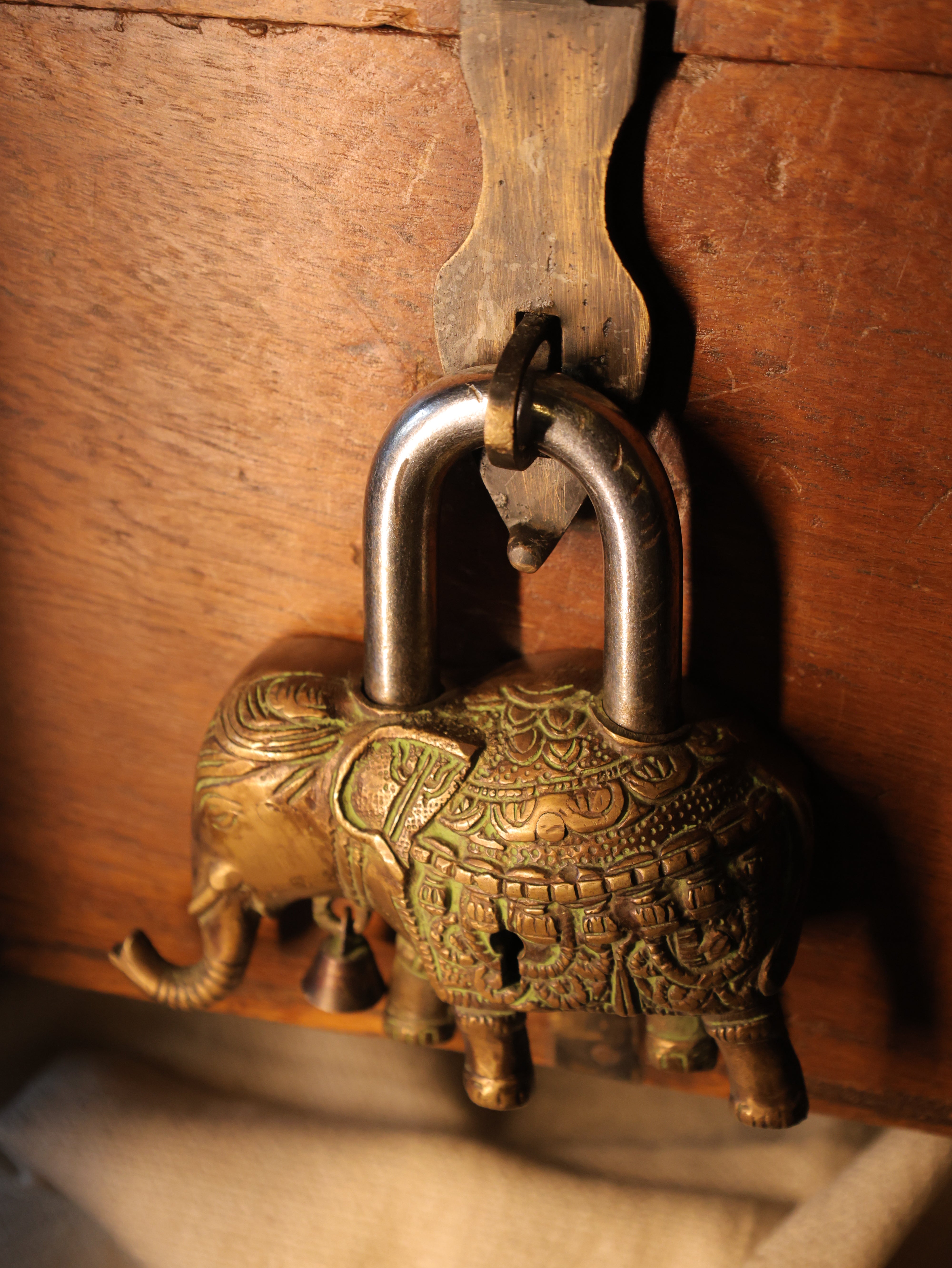Decorative padlock on a wooden surface