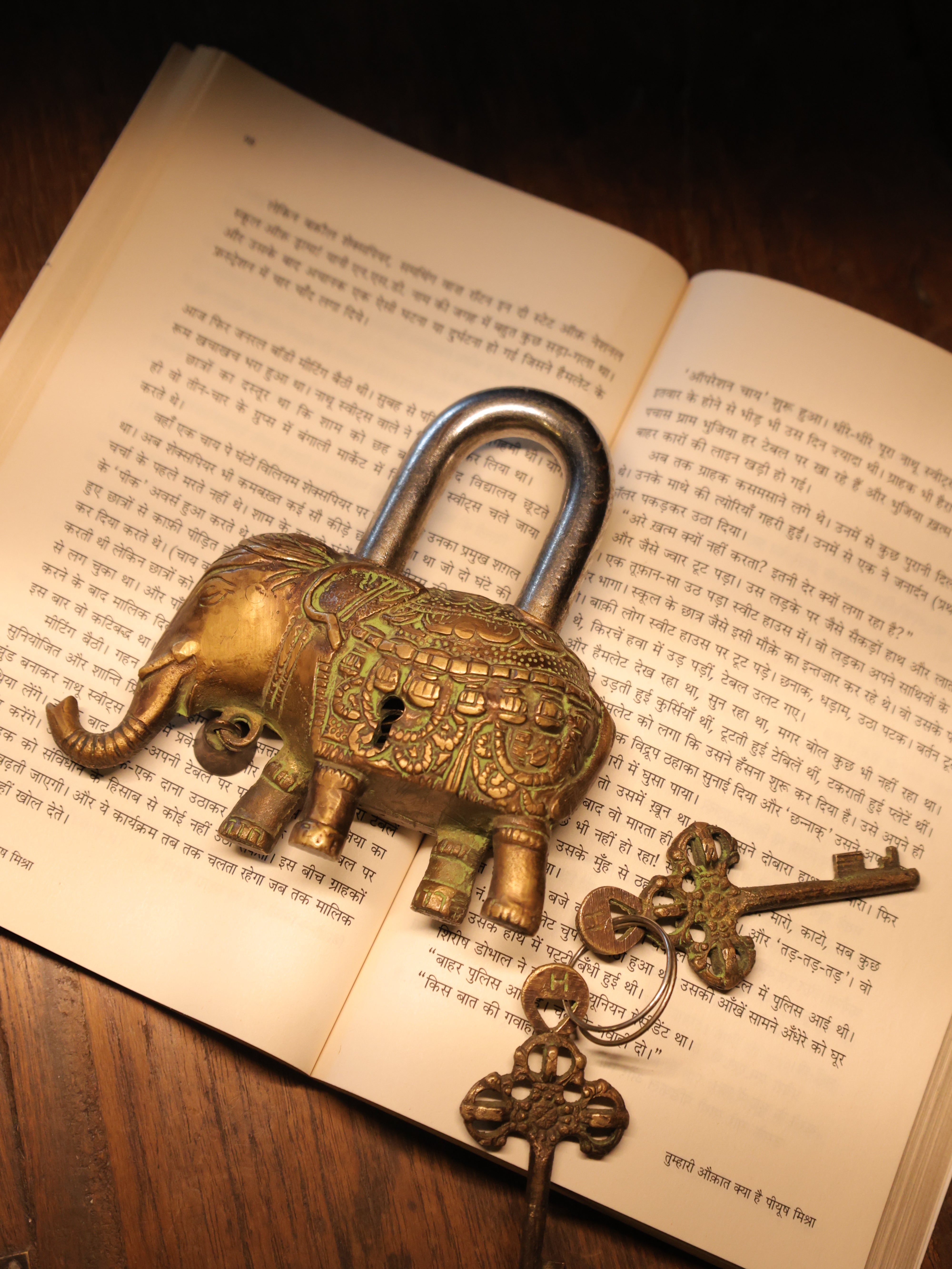 Decorative padlock and key on an open book