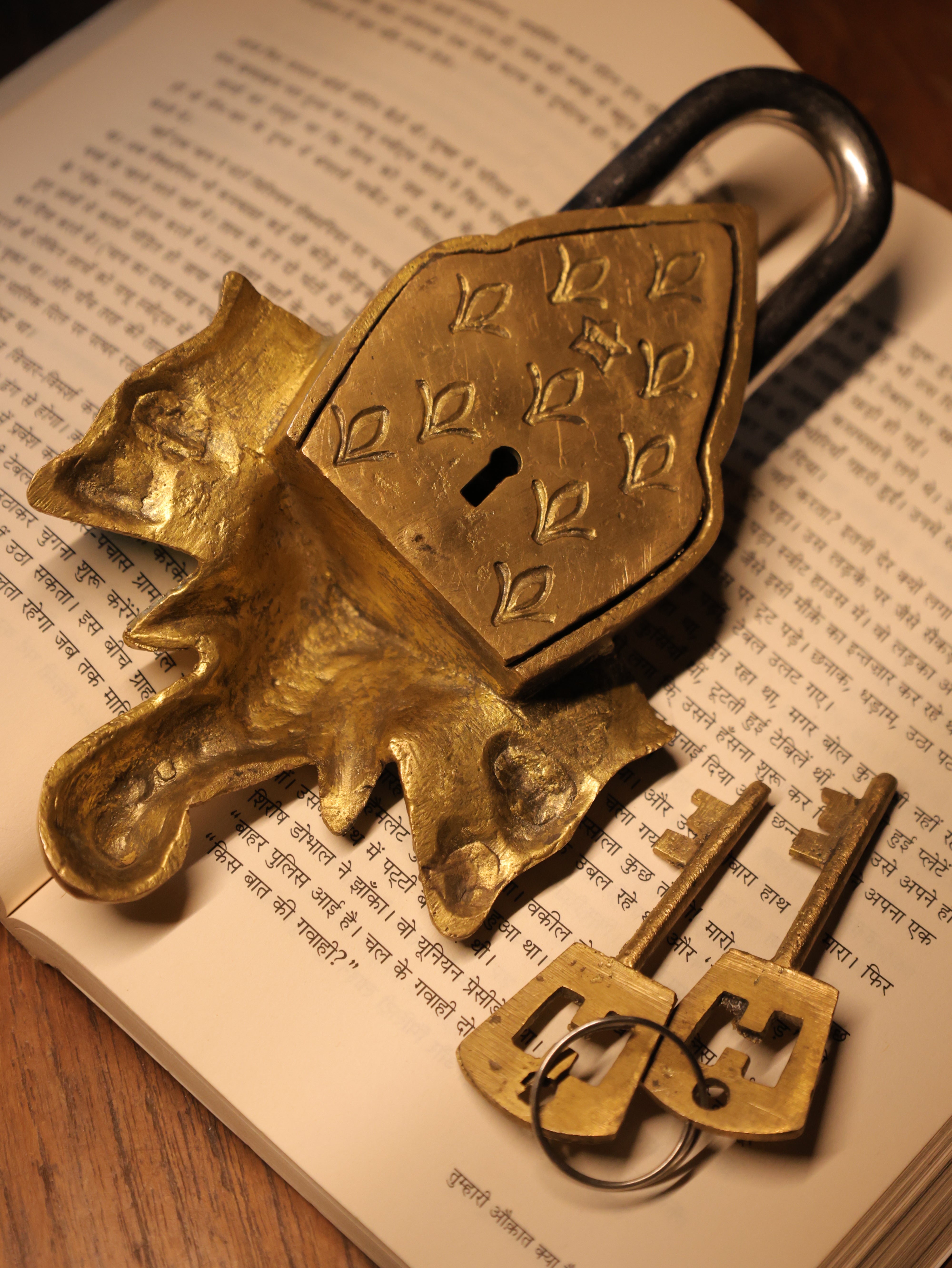 Gold padlock and keys on an open book