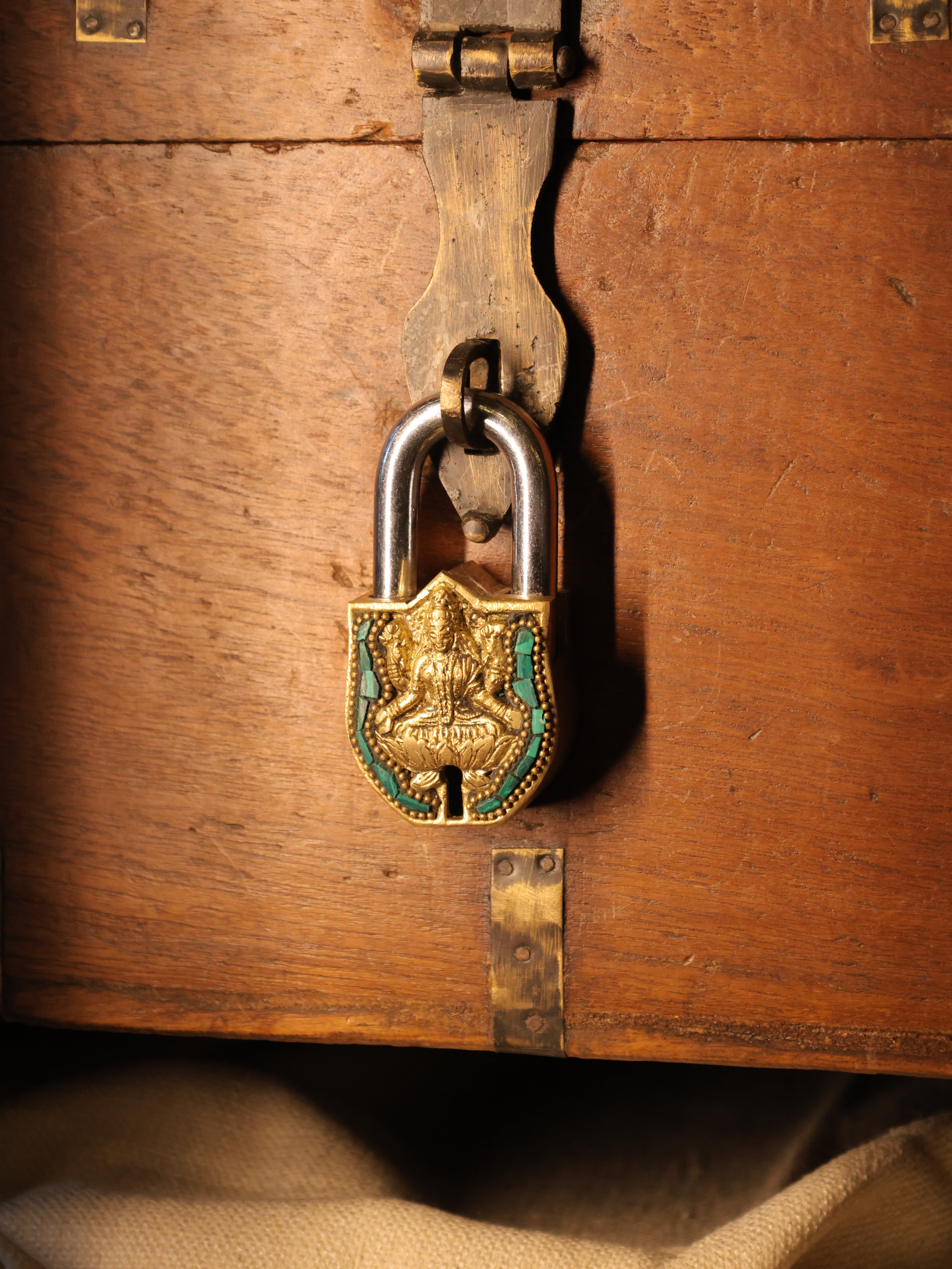 Decorative padlock on a wooden chest