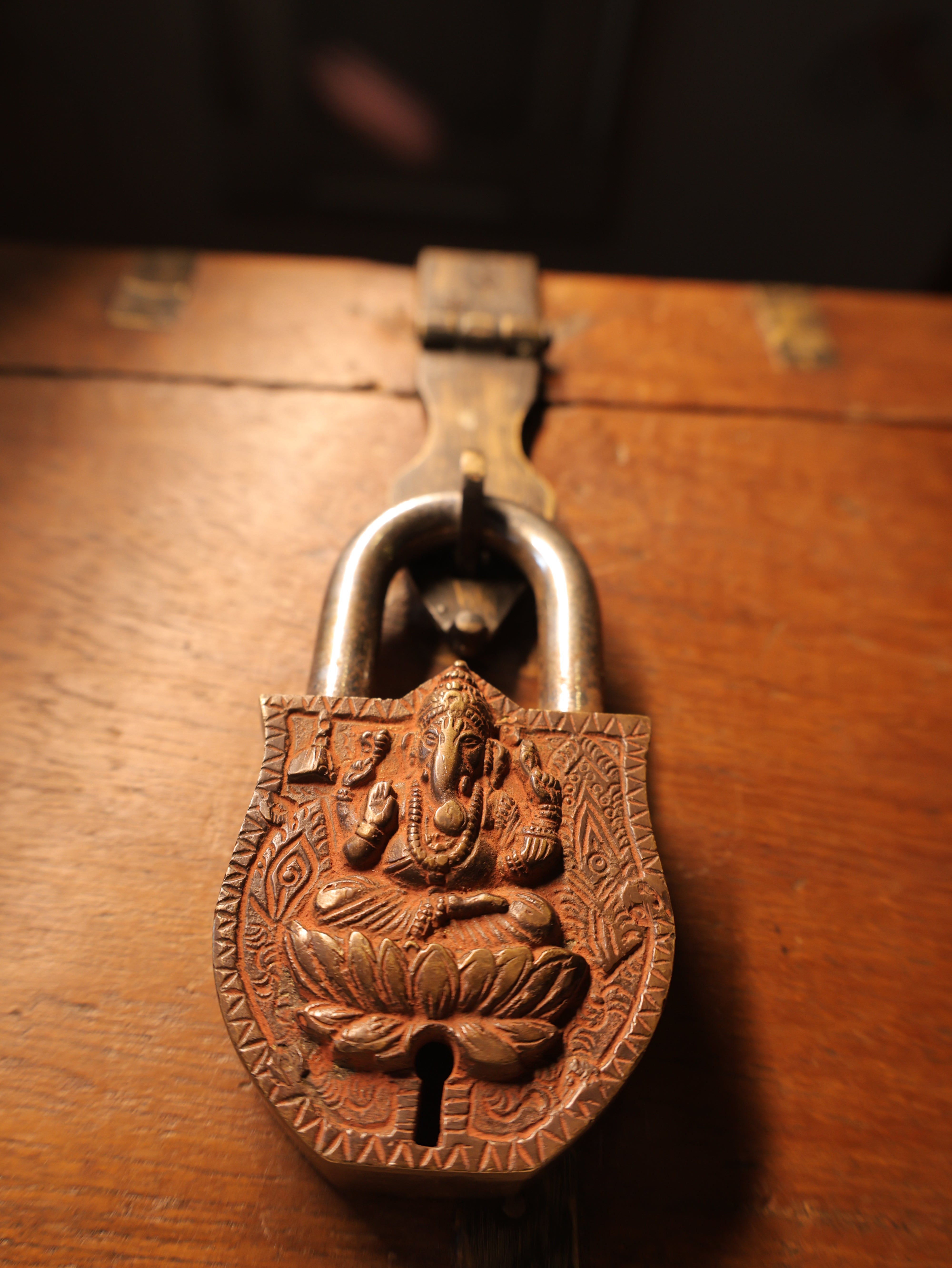 Decorative metal lock on a wooden surface