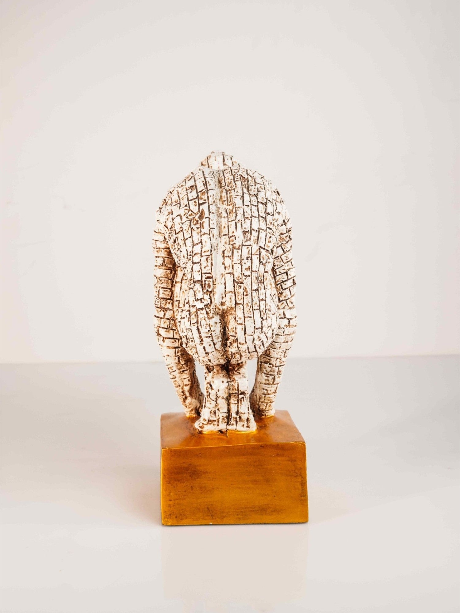 Elements of Piharwa Gold toned Greek man sculpture